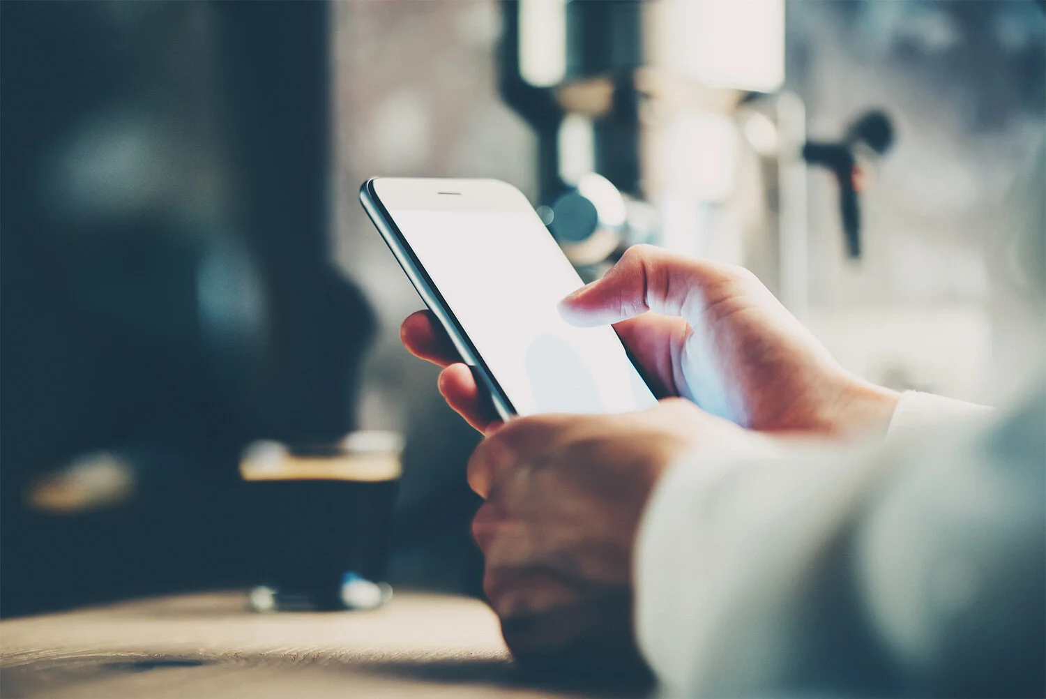 Smart phone using in female hand. Visual effects.jpg