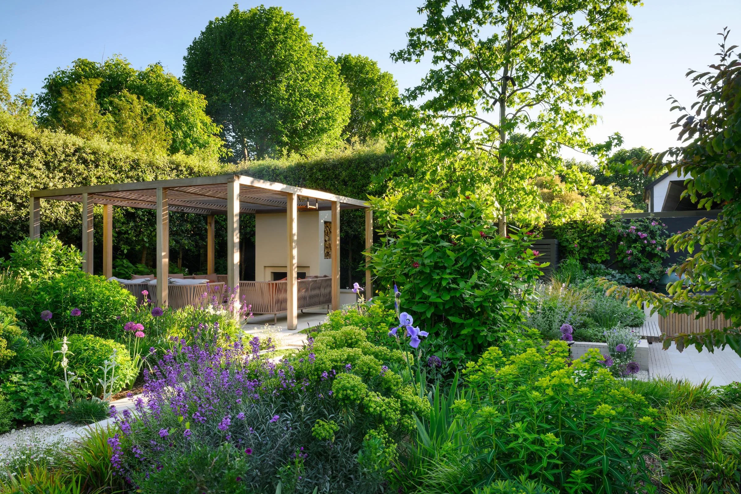 Putney garden after redesign with large planting beds and limestone steps
