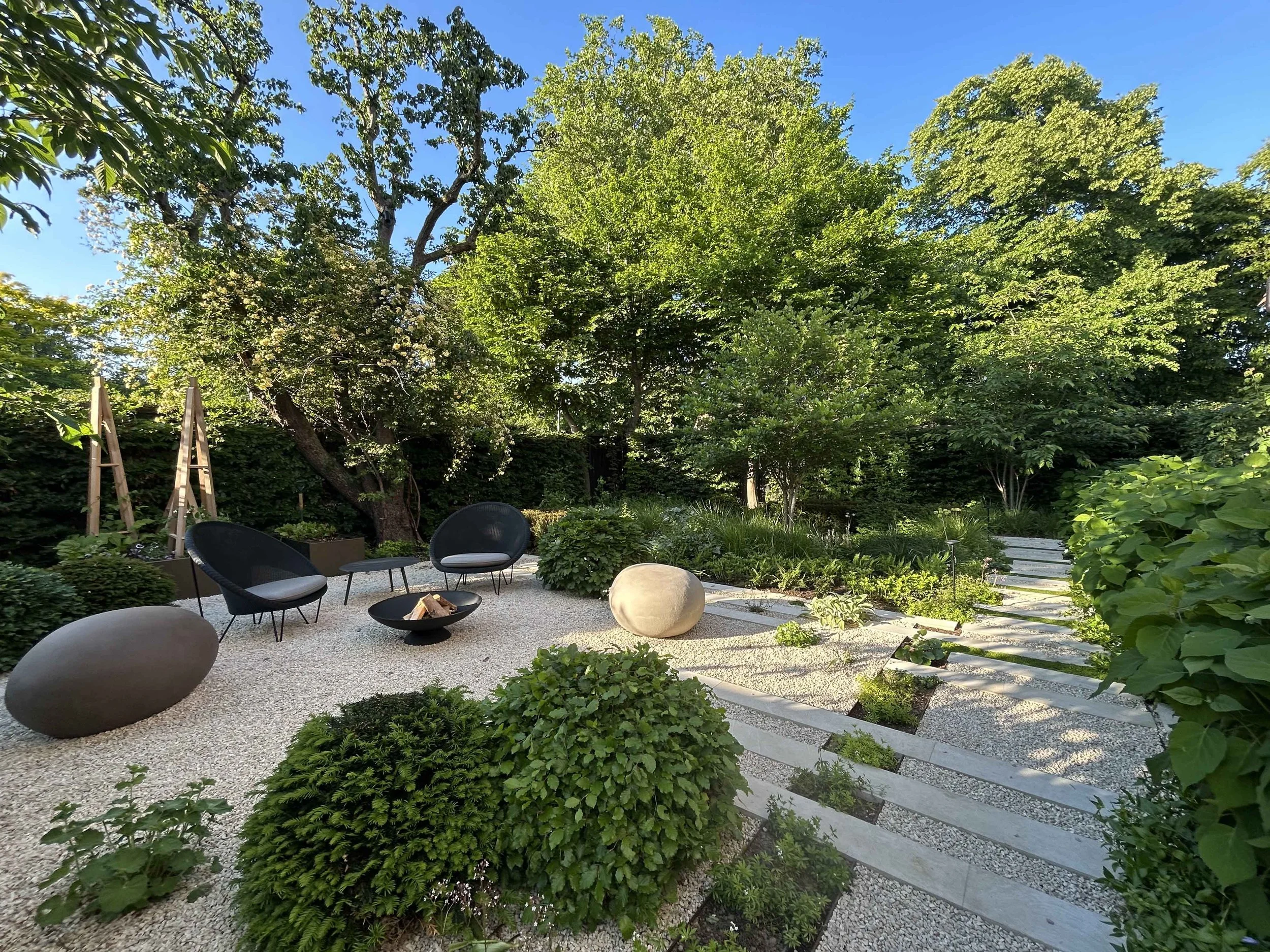 Side garden after transformation into a planted gravel seating terrace in Putney