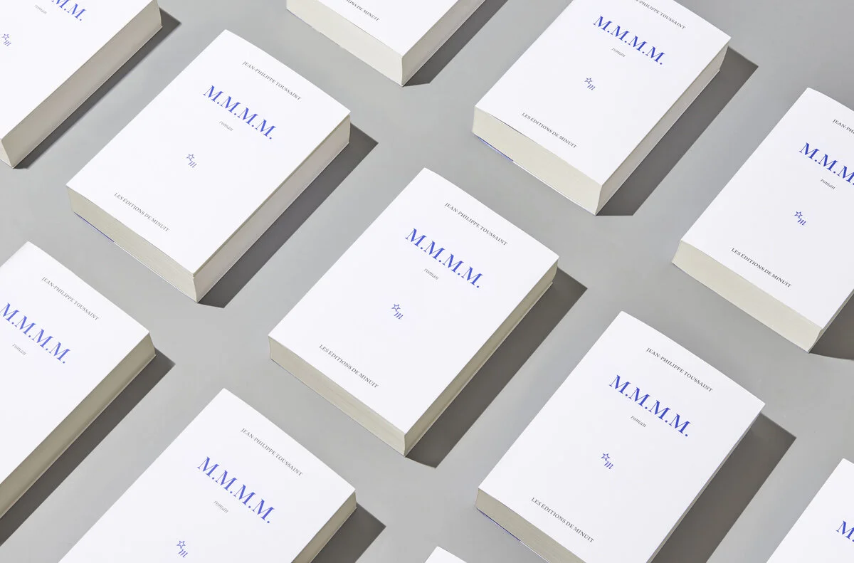  MMMM est la re-édition des romans  Faire l'amour ,  Fuir ,  La vérité sur Marie  et  Nue  de l’écrivain Jean-Philippe Toussaint.  137 x 195 /  704 pages / © Photography by Vincent Levrat 