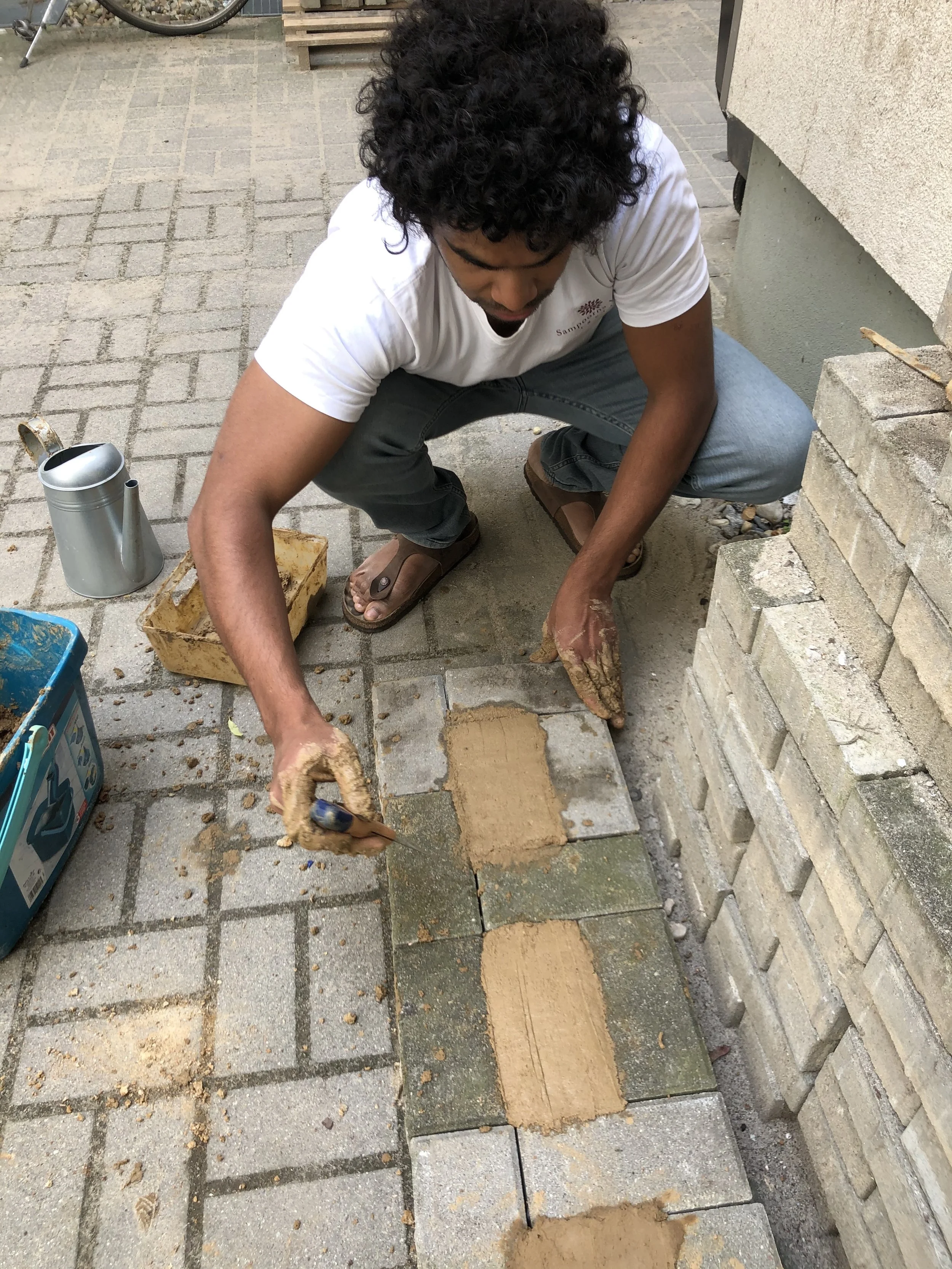 Joel making Adobe (Clay) bricks