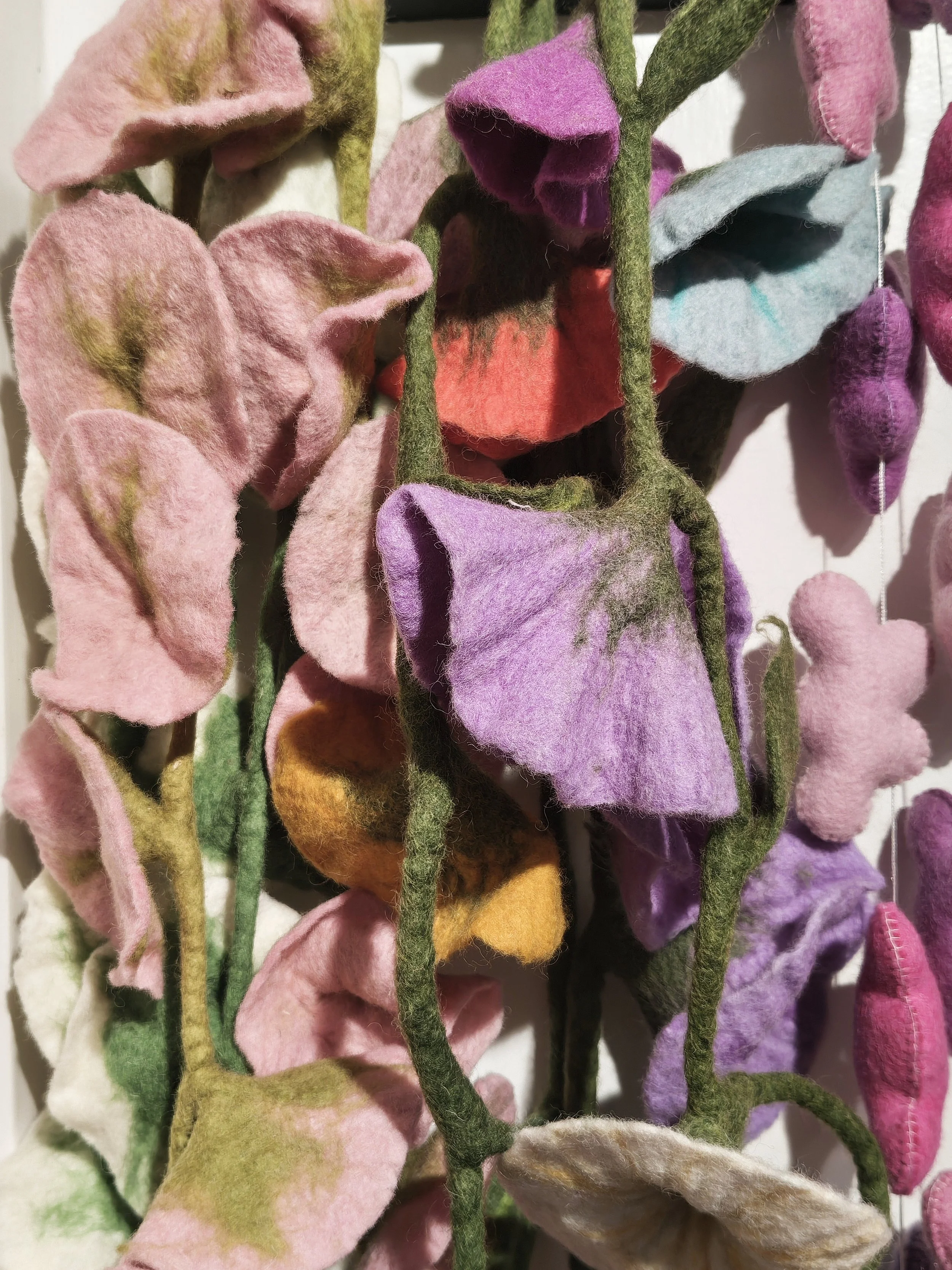 Felt flowers draped 
