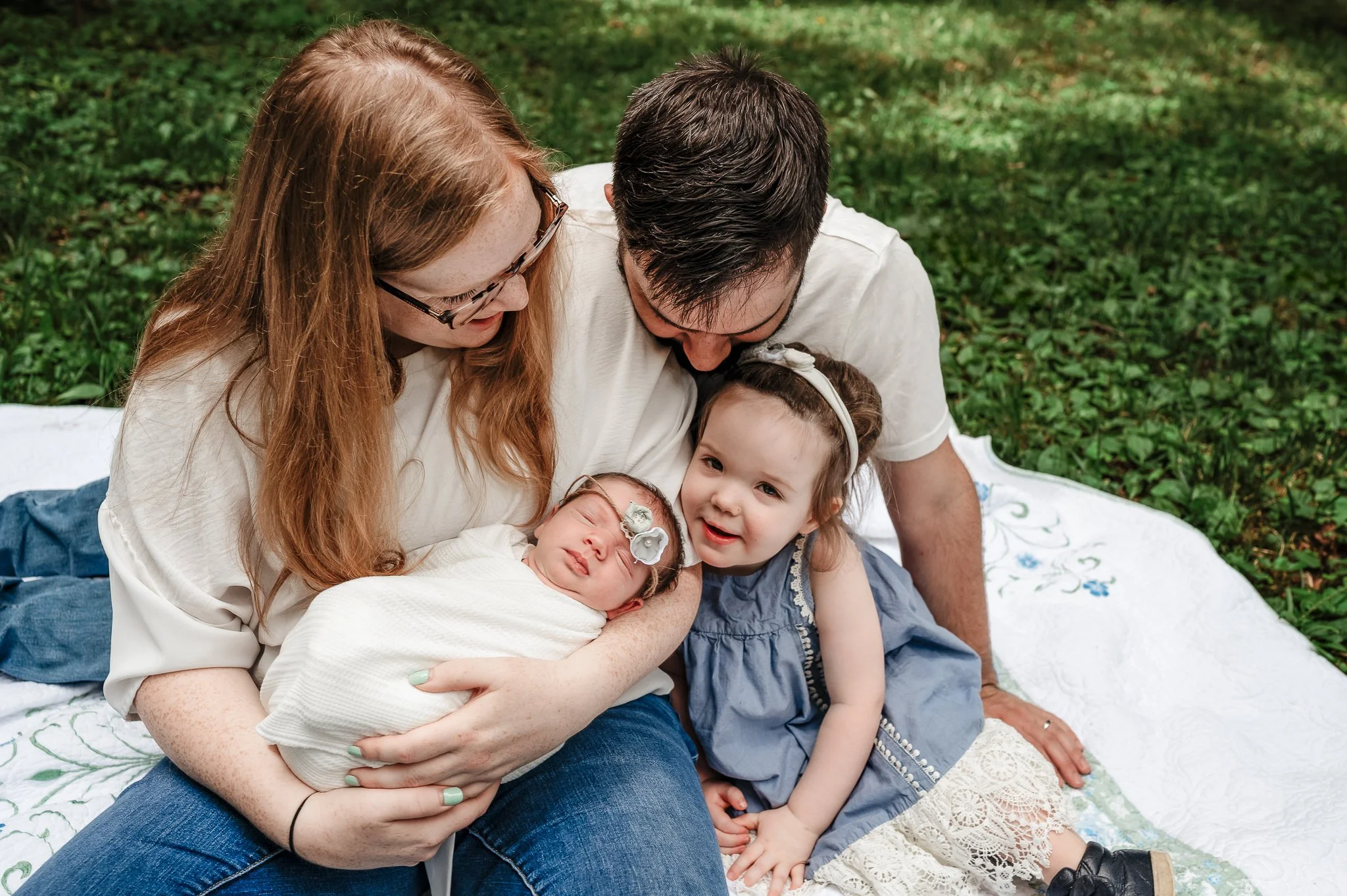 family in well coordinated outfits for photos