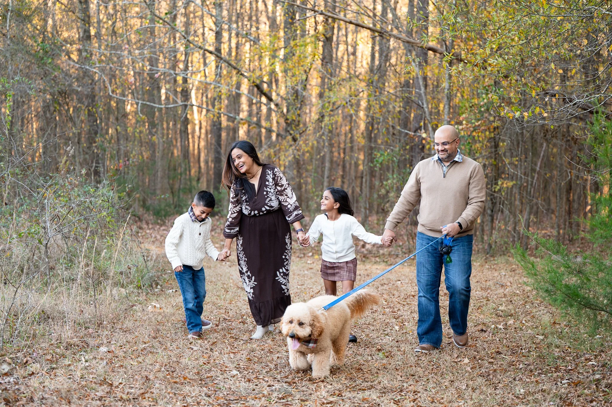 family walking together holding hands at Marvin Efird Park