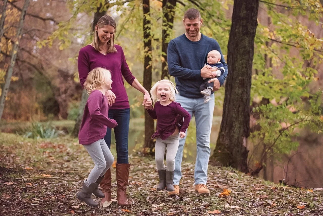 family walking together in a park for fall family photos