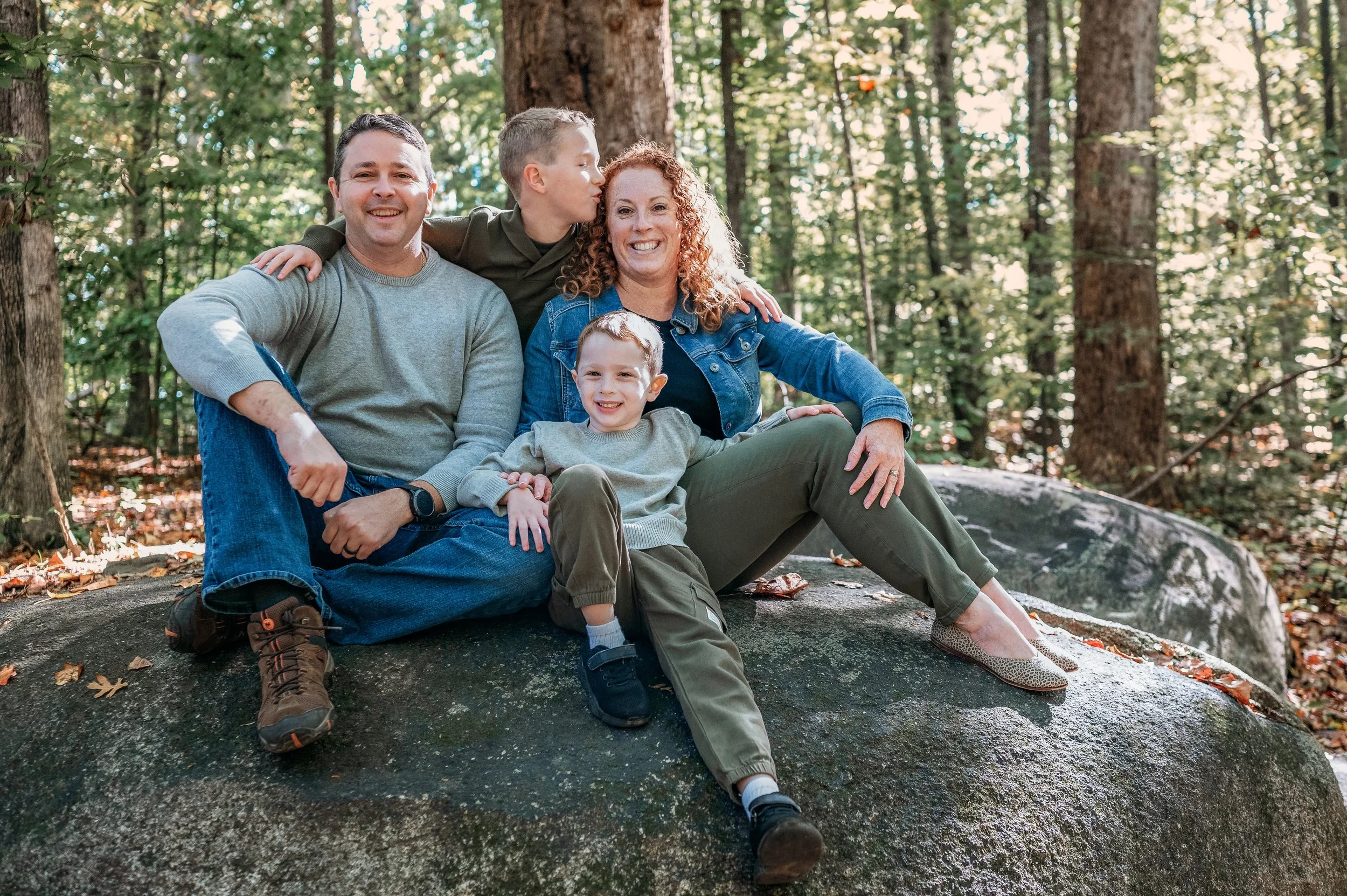 family in well coordinated outfits for fall photos at Big Rock Nature Preserve, Charlotte, NC