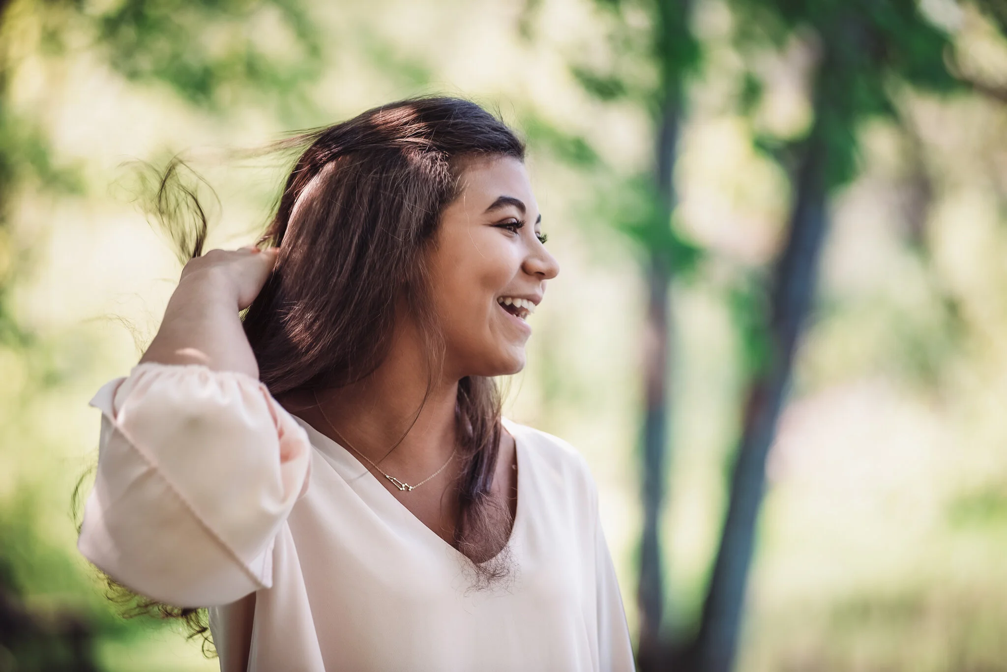 senior casually playing with hair and laughing
