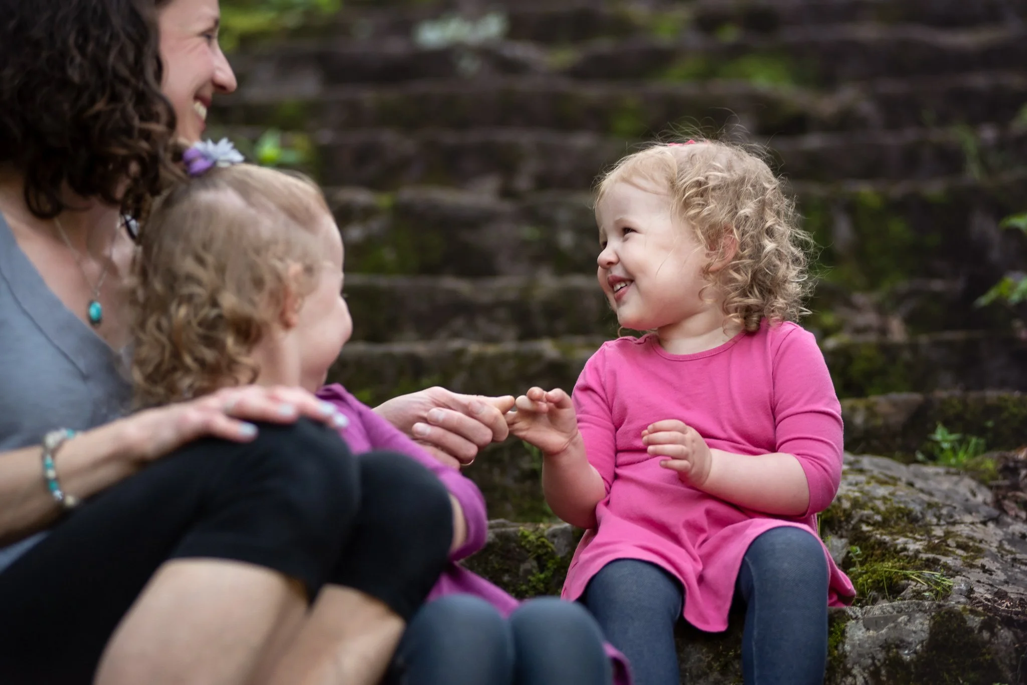 kids and mom giggling happily during family photo session, Charlotte, NC