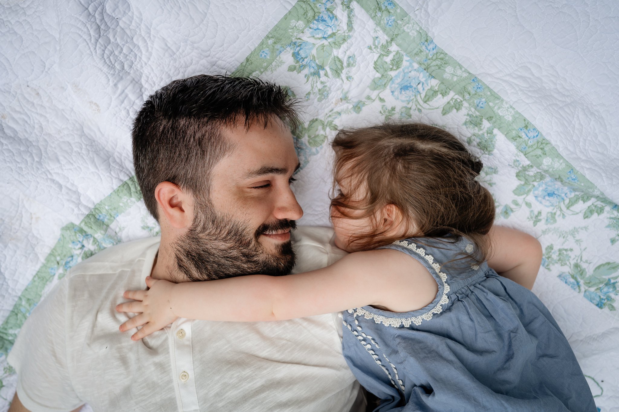 sweet connection between dad and daughter during family photo session