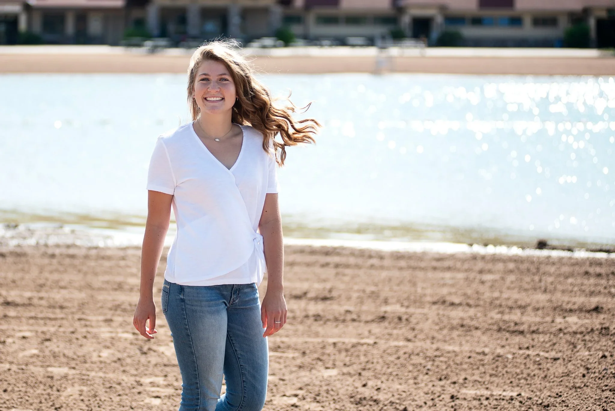 senior girl smiling naturally and walking creates great senior photos
