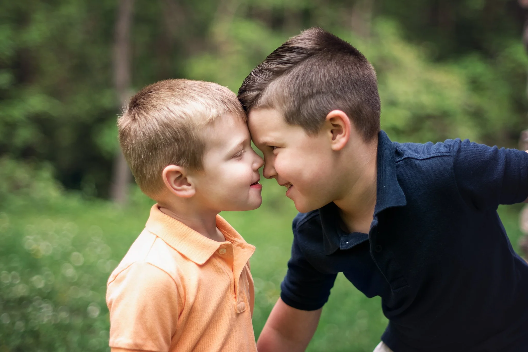Siblings goofing off and having fun during a family photo session