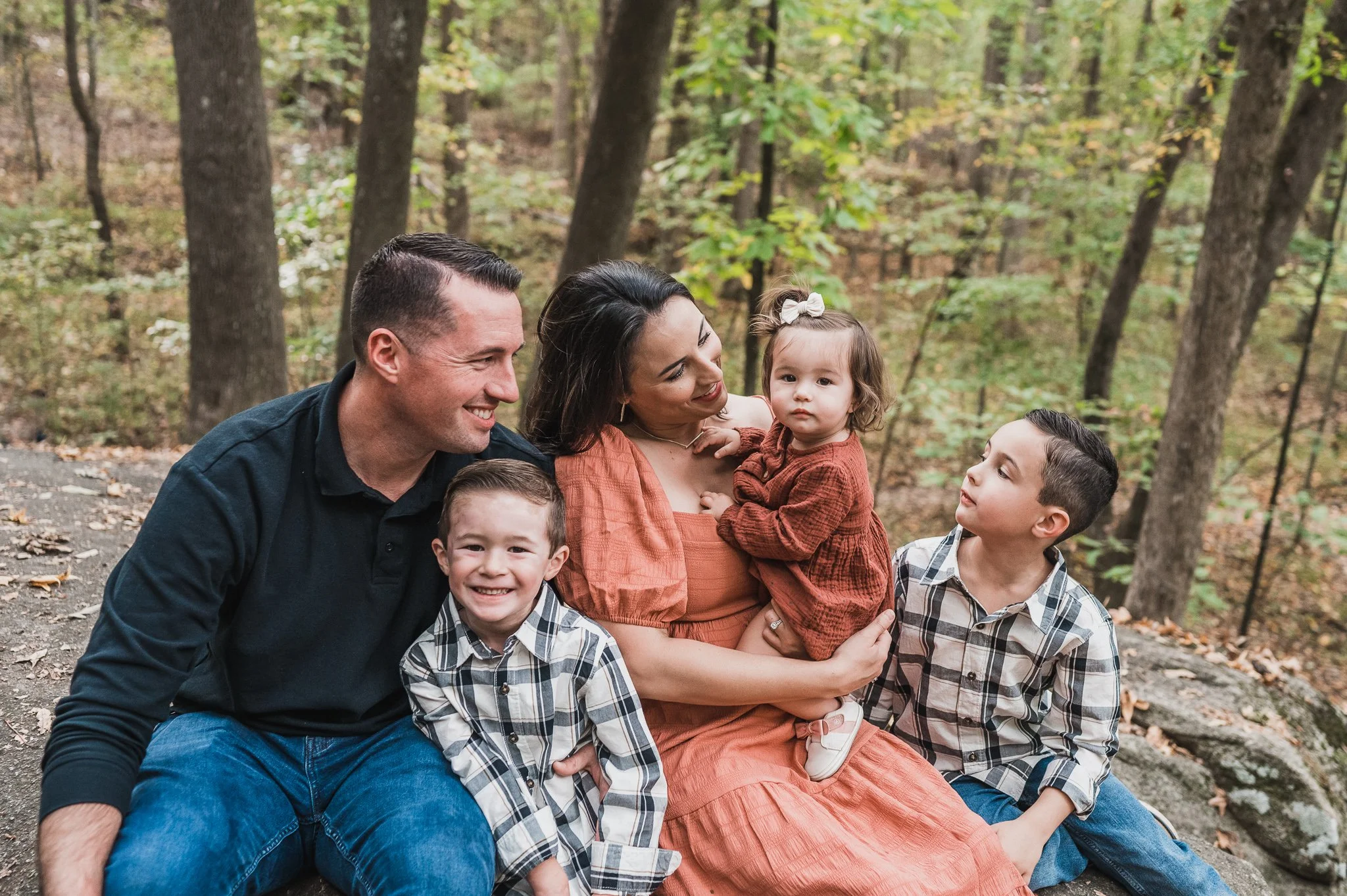 family in well coordinated outfits for fall photos at Big Rock Nature Preserve, Charlotte, NC