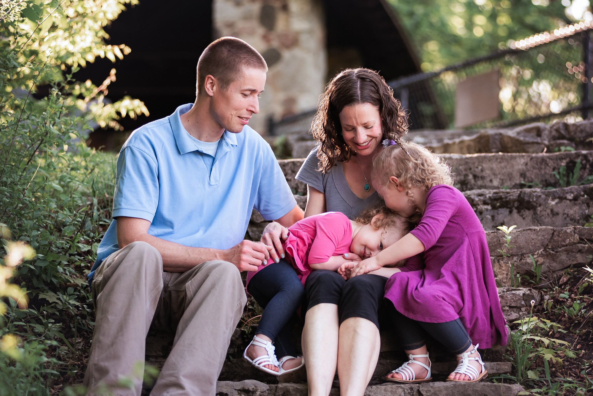 family in well coordinated outfits for photo session