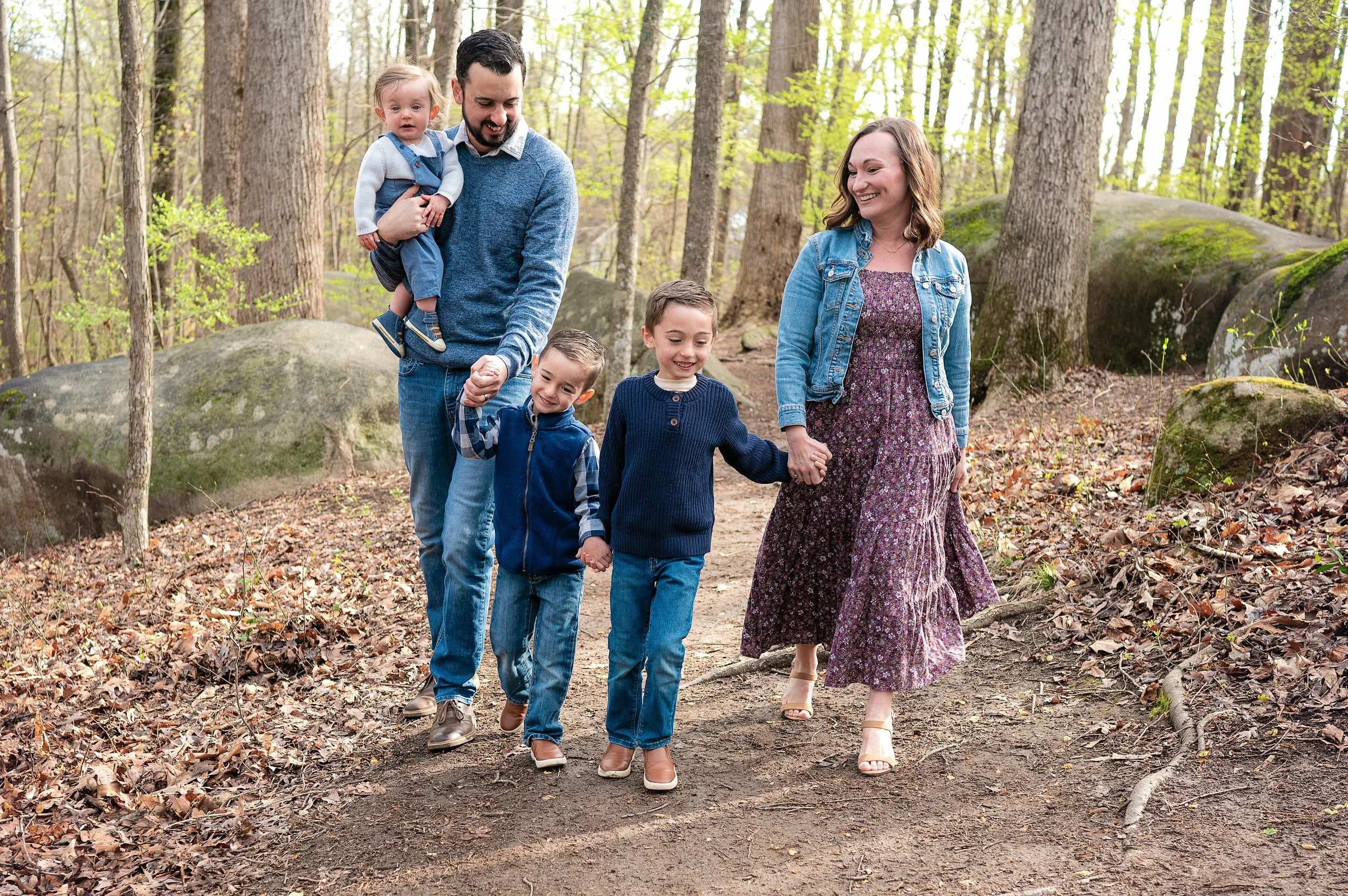 family walking together during photo session at big rock nature preserve, charlotte, nc