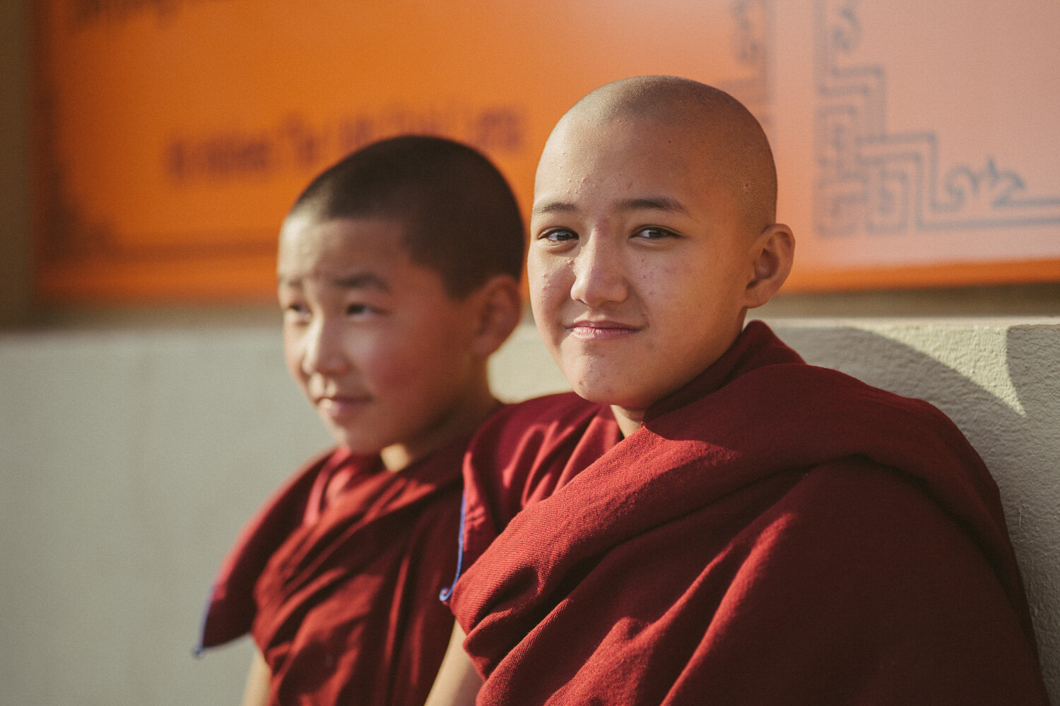 Kopan Tibetan Buddhist Monastery during a traditional festival with locals in vibrant costumes.