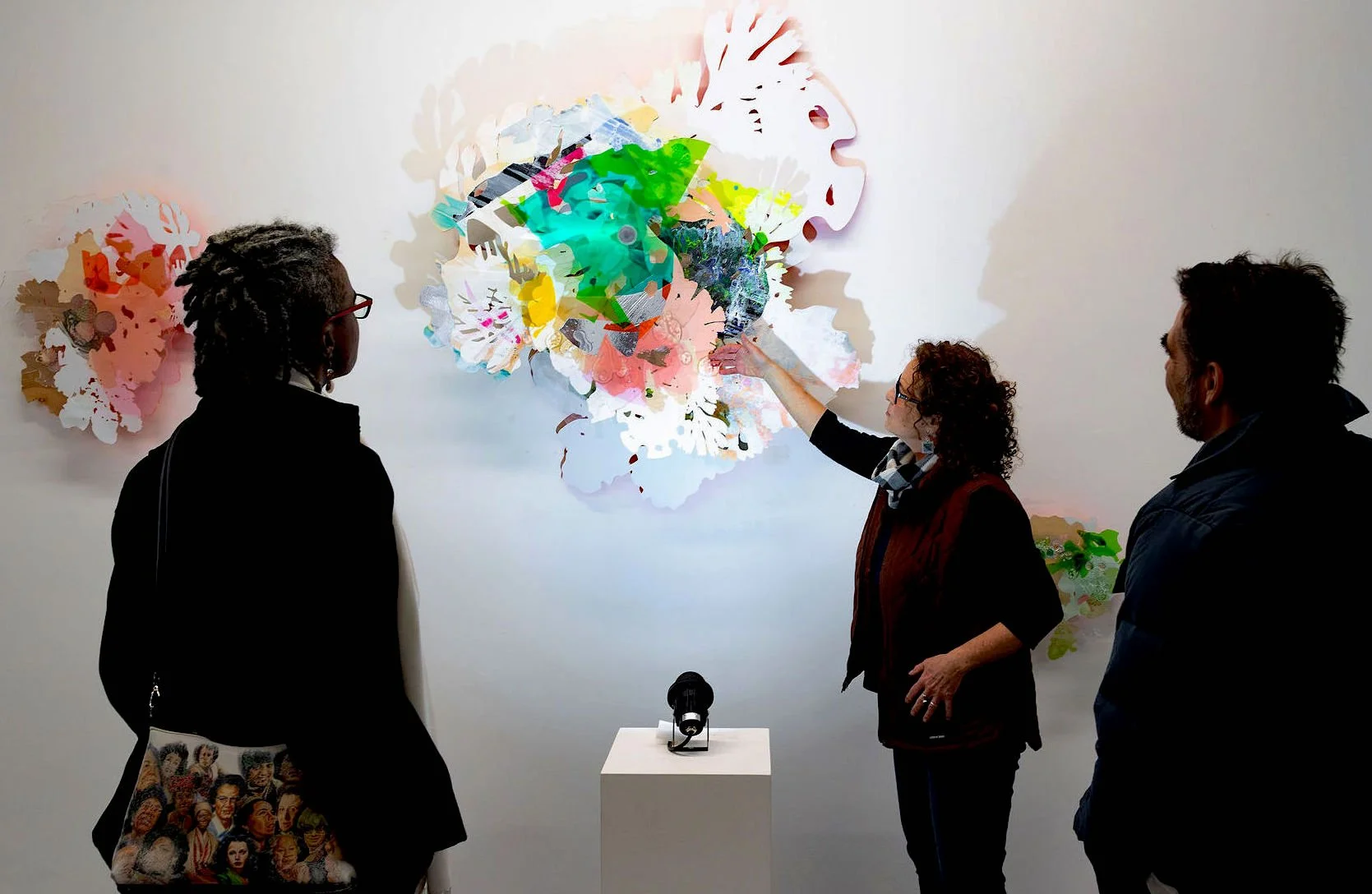 in front of Pink Sea-Through wall sculpture.  