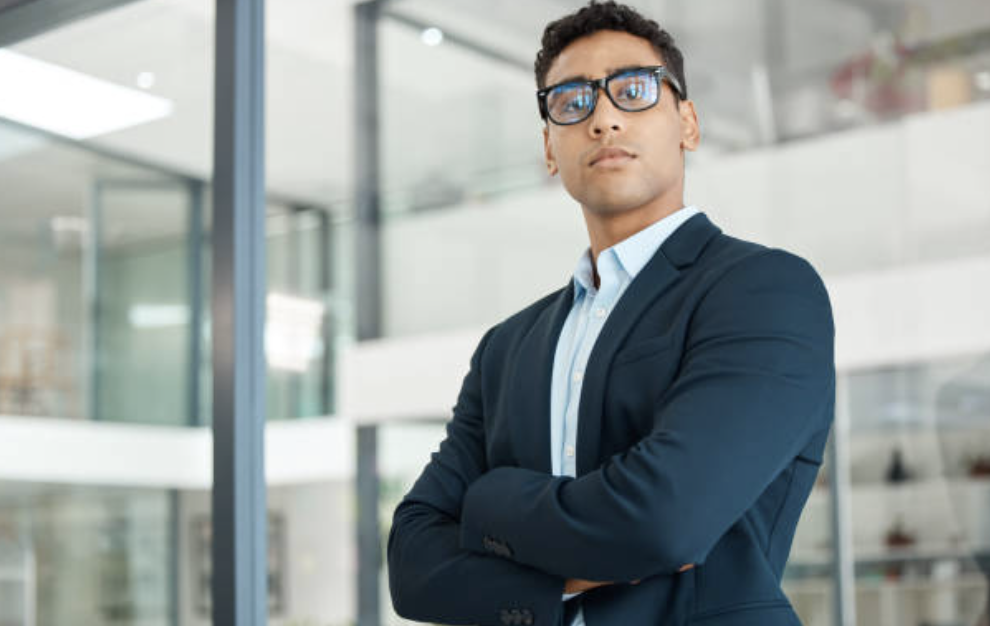 nonbinary mixed race executive looking confident and calm