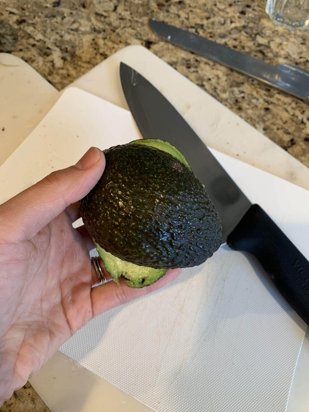 Step 2: Twist the avocado to open it