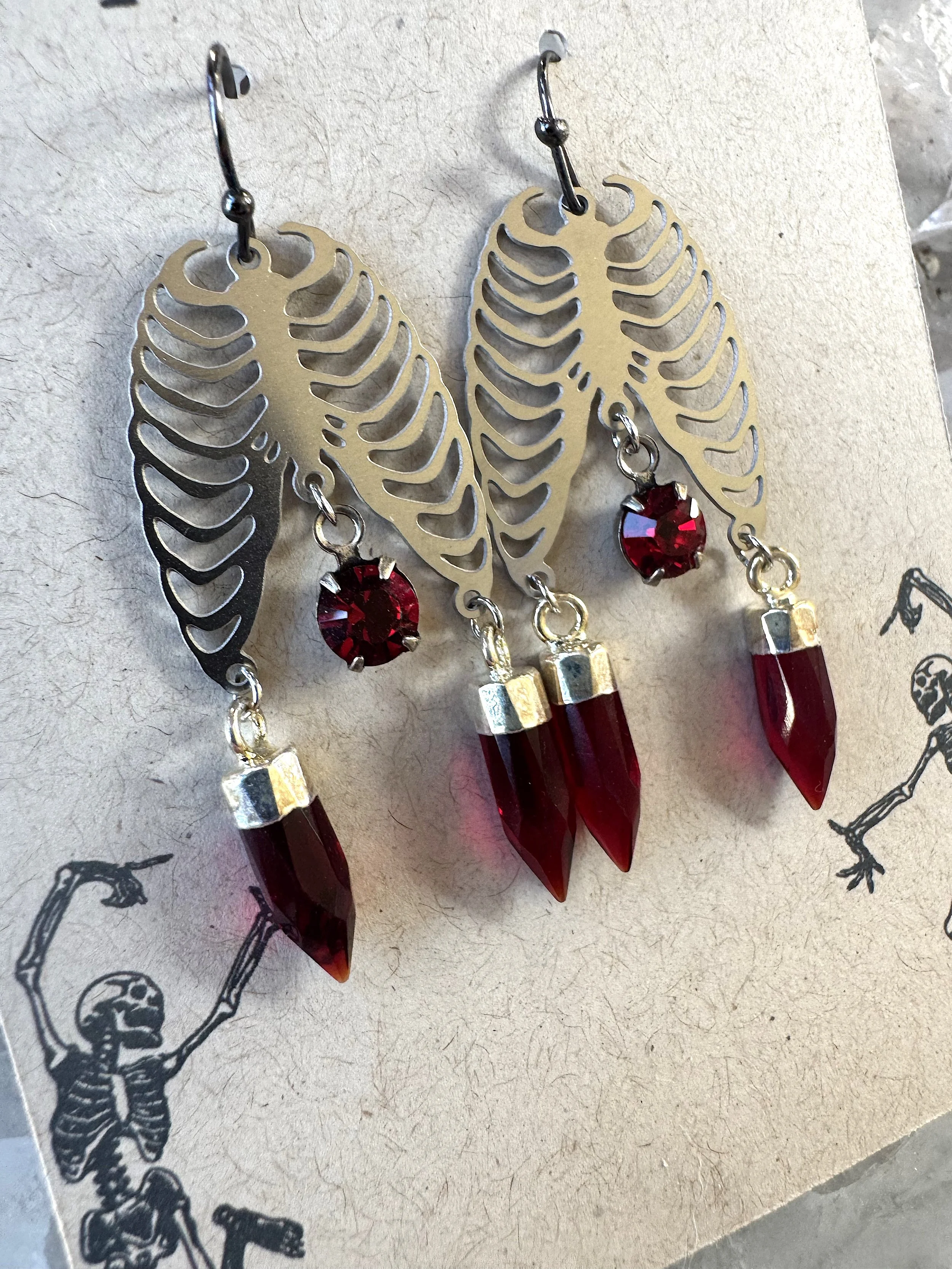 Silver Skeleton with Garnet Crystals & Points