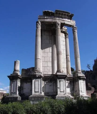 columns of temple of Vesta against a blue sky