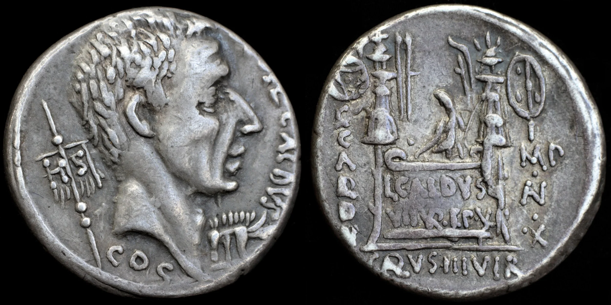 ancient Roman silver coin with a man's head on one side and a scene with an altar on the other side