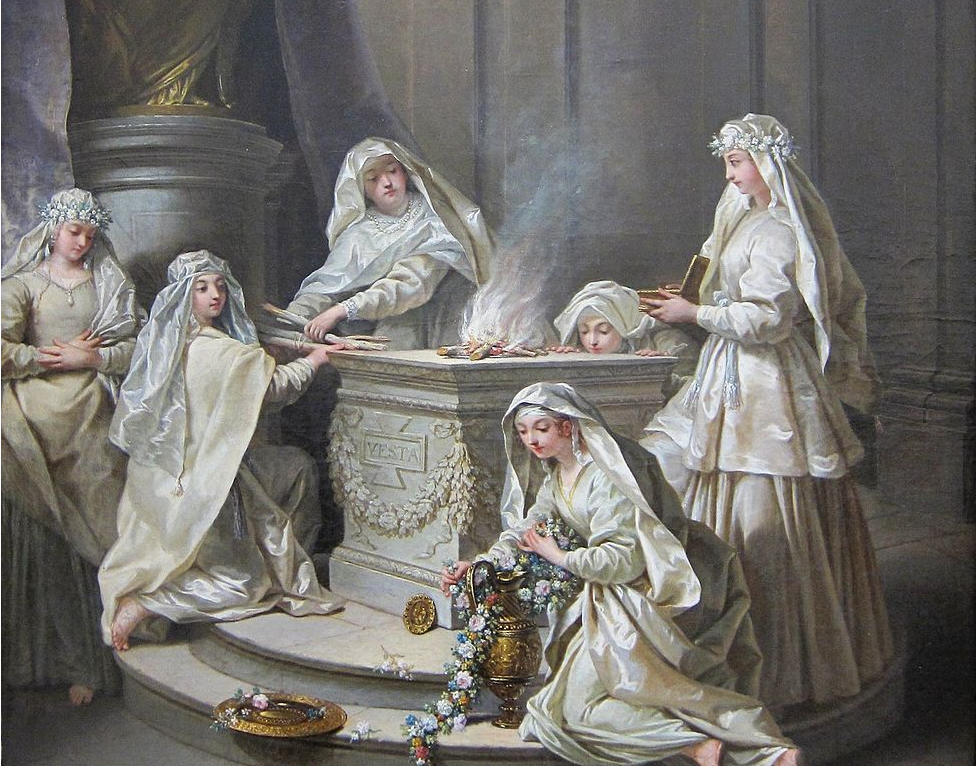 priestesses in white dresses tending to a fire on a marble altar