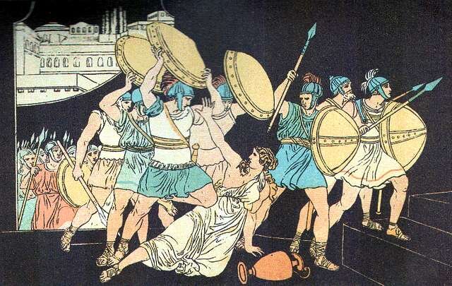 a woman in classical attire on the ground, as soldiers carrying shields rush by her. One soldier raises his shield above her