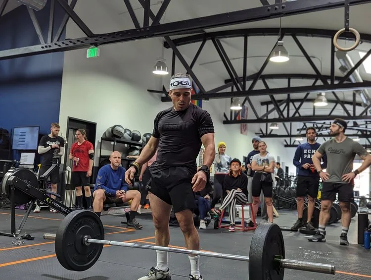 An athlete gets ready to lift a barbell at CrossFit Echo Park