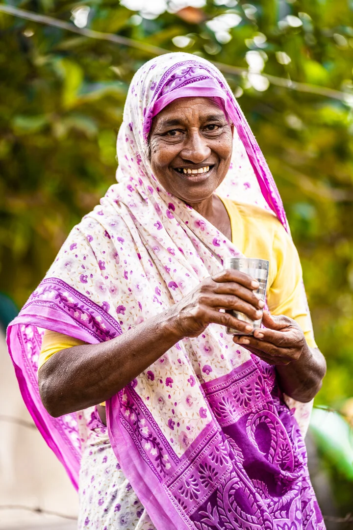 Clean Water Project Old Lady with Glass.JPG