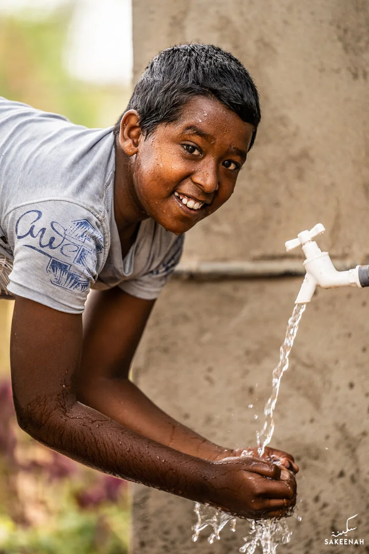 Clean Water Project Boy Drinking Tap.jpg