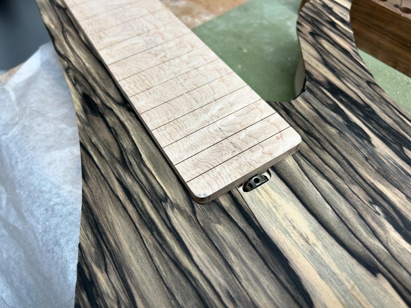 More progress on Dveed&rsquo;s custom 12-string bass. The Pale Moon Ebony top is fit to the body. I&rsquo;ll make as much more progress as I can while awaiting the custom hardware #stgermaineguitars #12stringbass #custombass #boutiquebass #handmadein