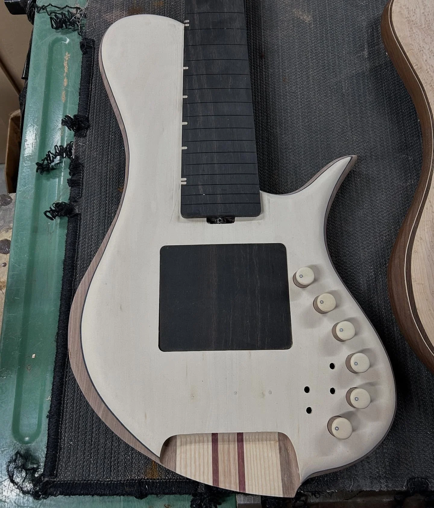 Finish sanding a couple of Bustards for @bassnsoulgear and @mike_vallis_bass 

32&rdquo; scale headless 6-string - Holly top, Blqck Walnut wings, Ash and Purpleheart neck, Ebony fretboard neck-through-body, MJS dual-coils with Flexcore 4-band

33&rdq