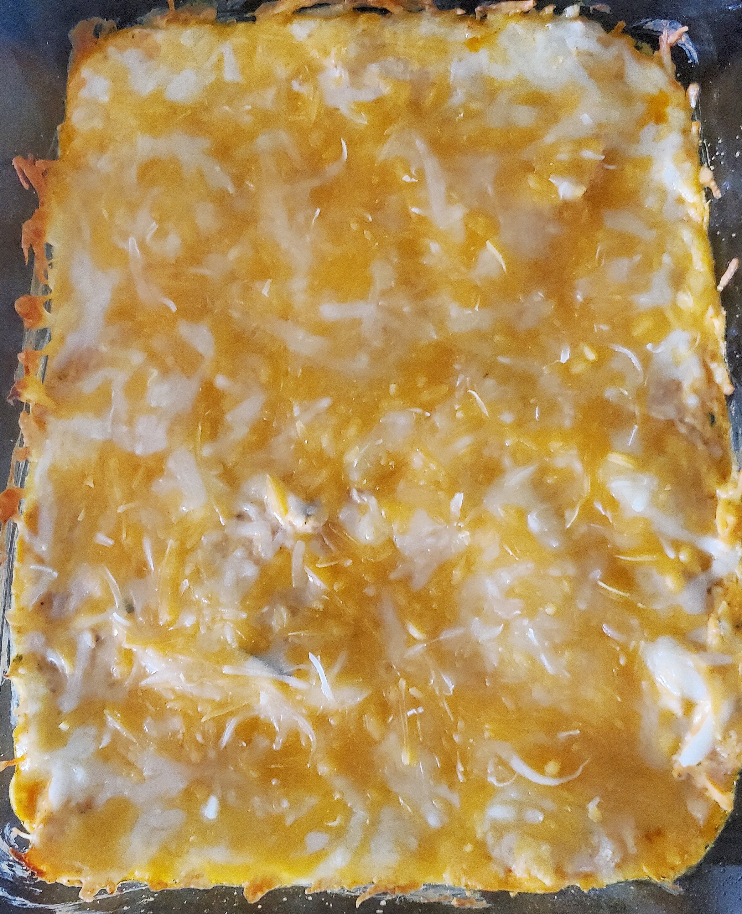 Add to a 9x9 baking dish, then top with shredded cheese. Bake at 425 for 12-15 minutes. - 