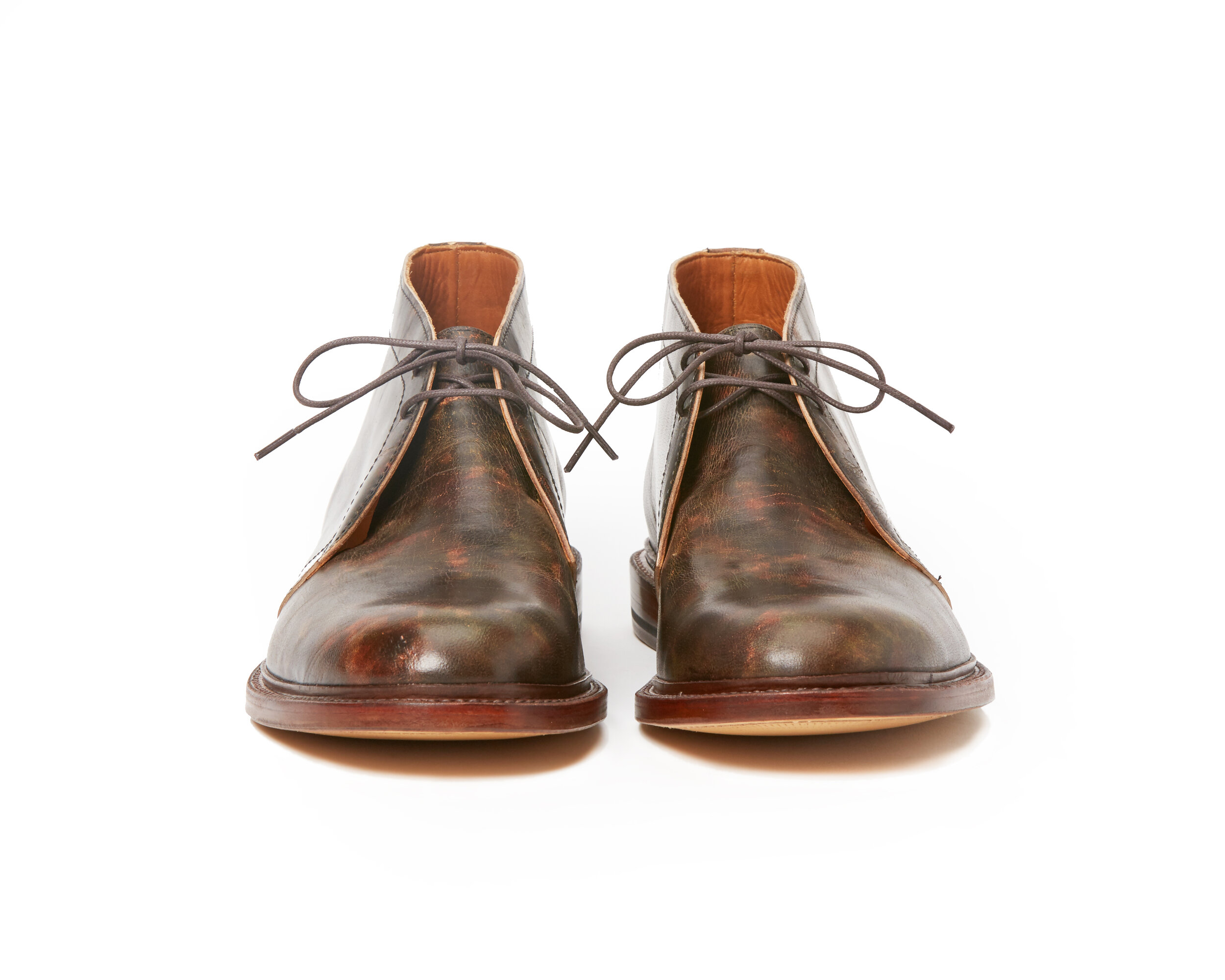 a collaborative back and forth with Tusting and Burnett, UK. Vegetable tanned African goat, tipped with a roller to mimic hand-staining.