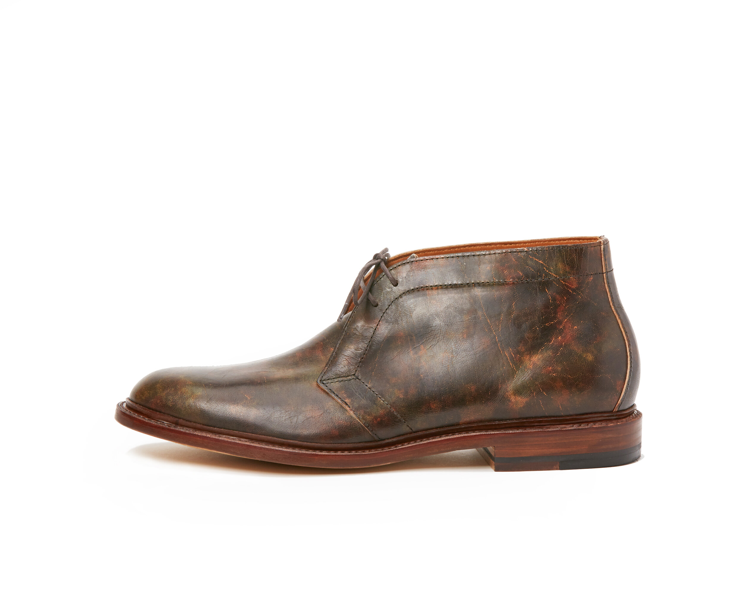 a collaborative back and forth with Tusting and Burnett, UK. Vegetable tanned African goat, tipped with a roller to mimic hand-staining.