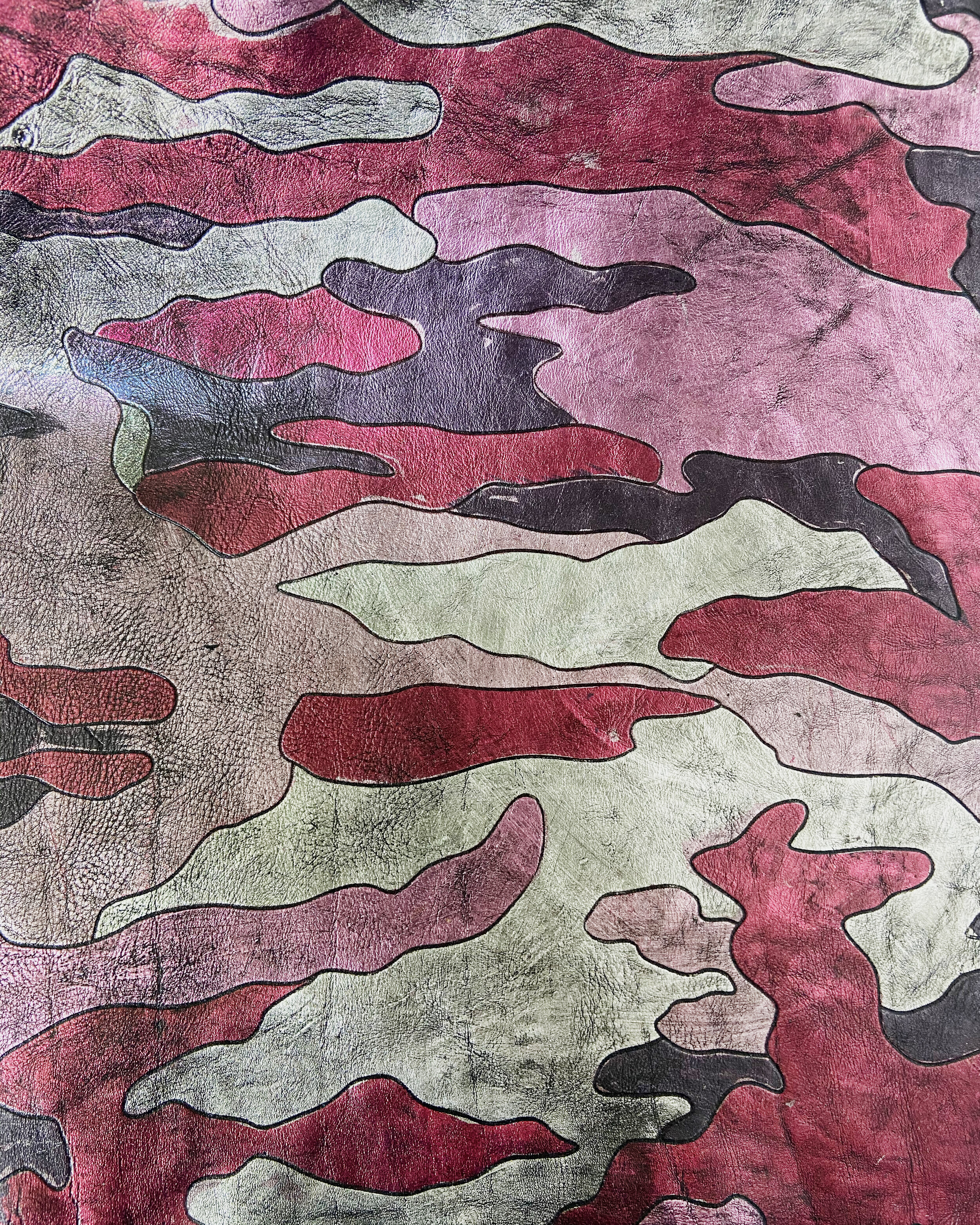 laser engraved camo pattern inspired by the traditional Woodland pattern from the US army, metallic foils applied by hand, with further finishing