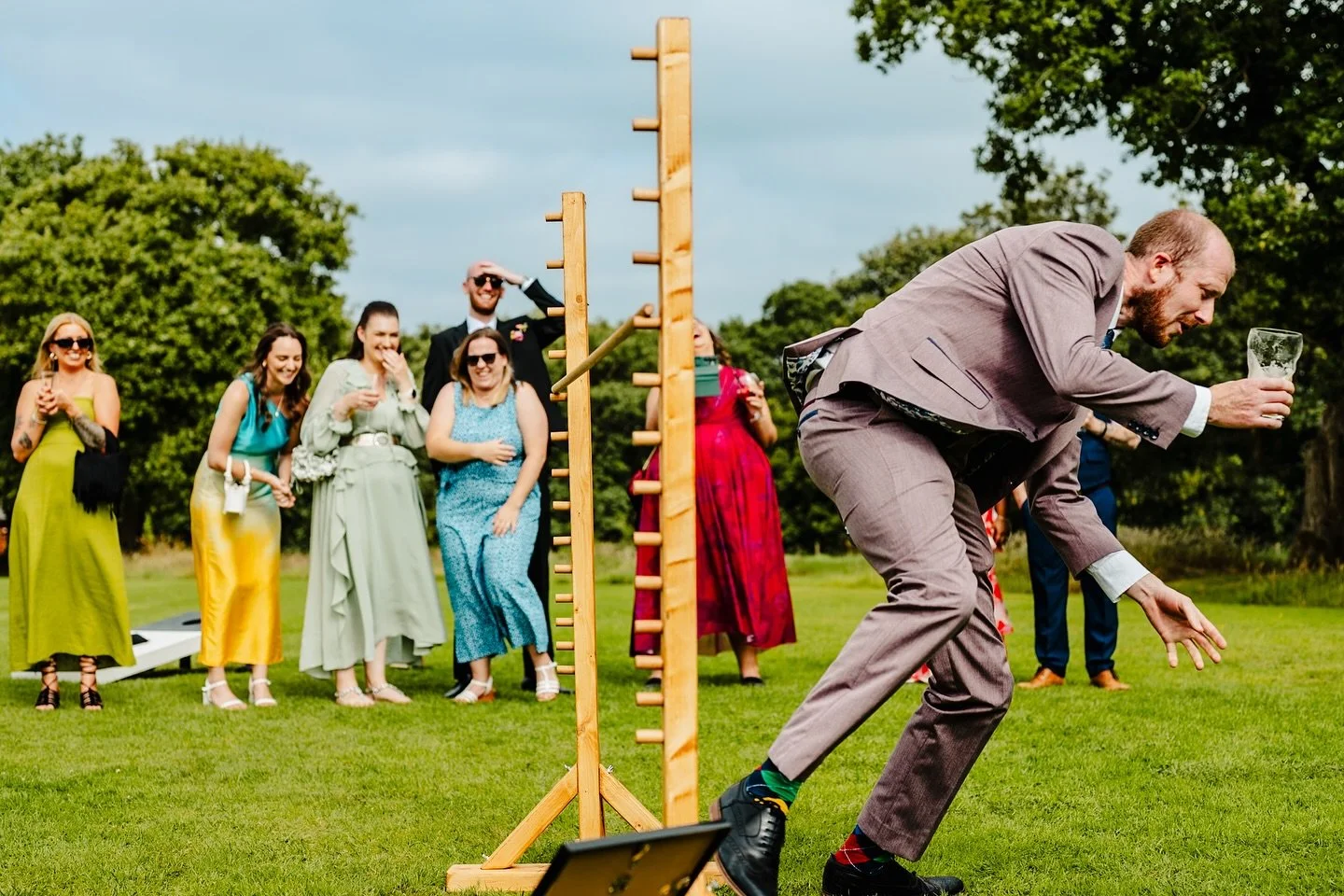 New limbo rule: always have a drink on the go

#limbo #weddinggames #manchesterweddingphotographer #outdoorwedding