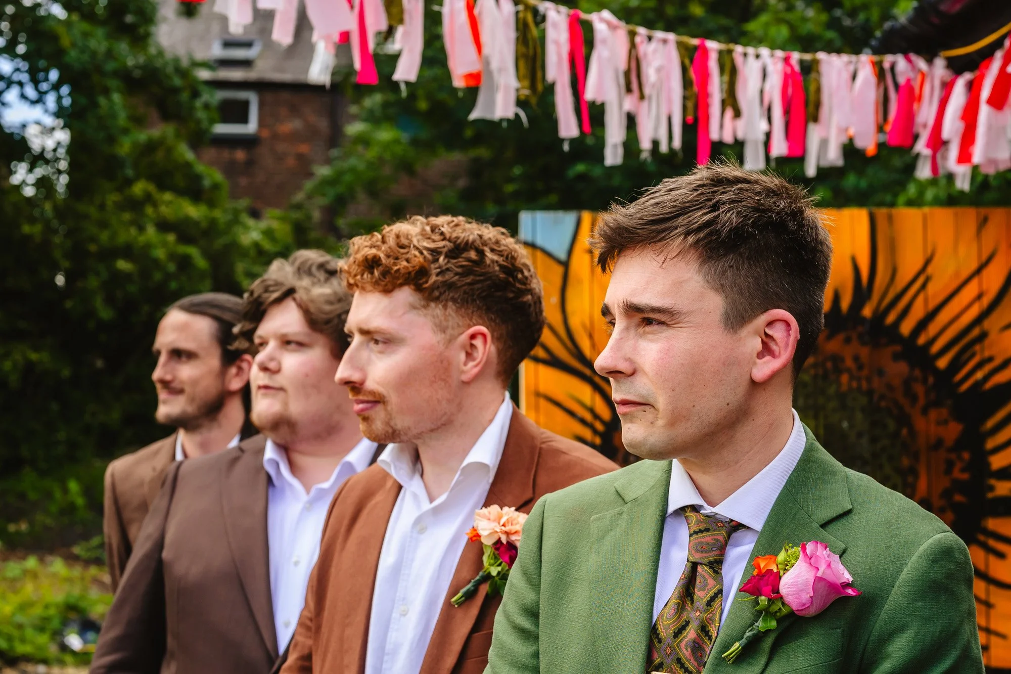  A man waits with his three groomsmen for his bride to walk down the aisle 