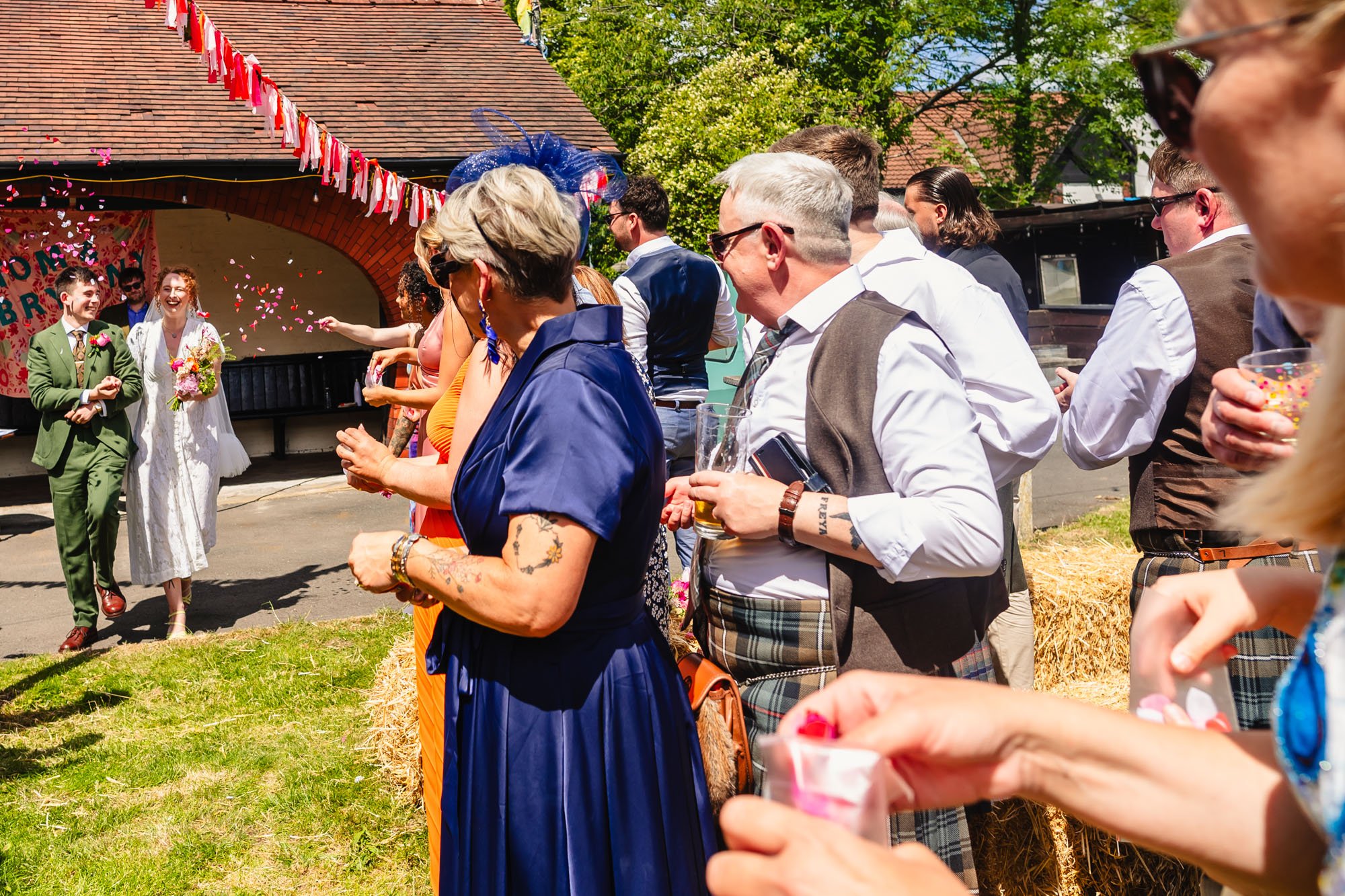 Wedding guests wait to throw confetti 