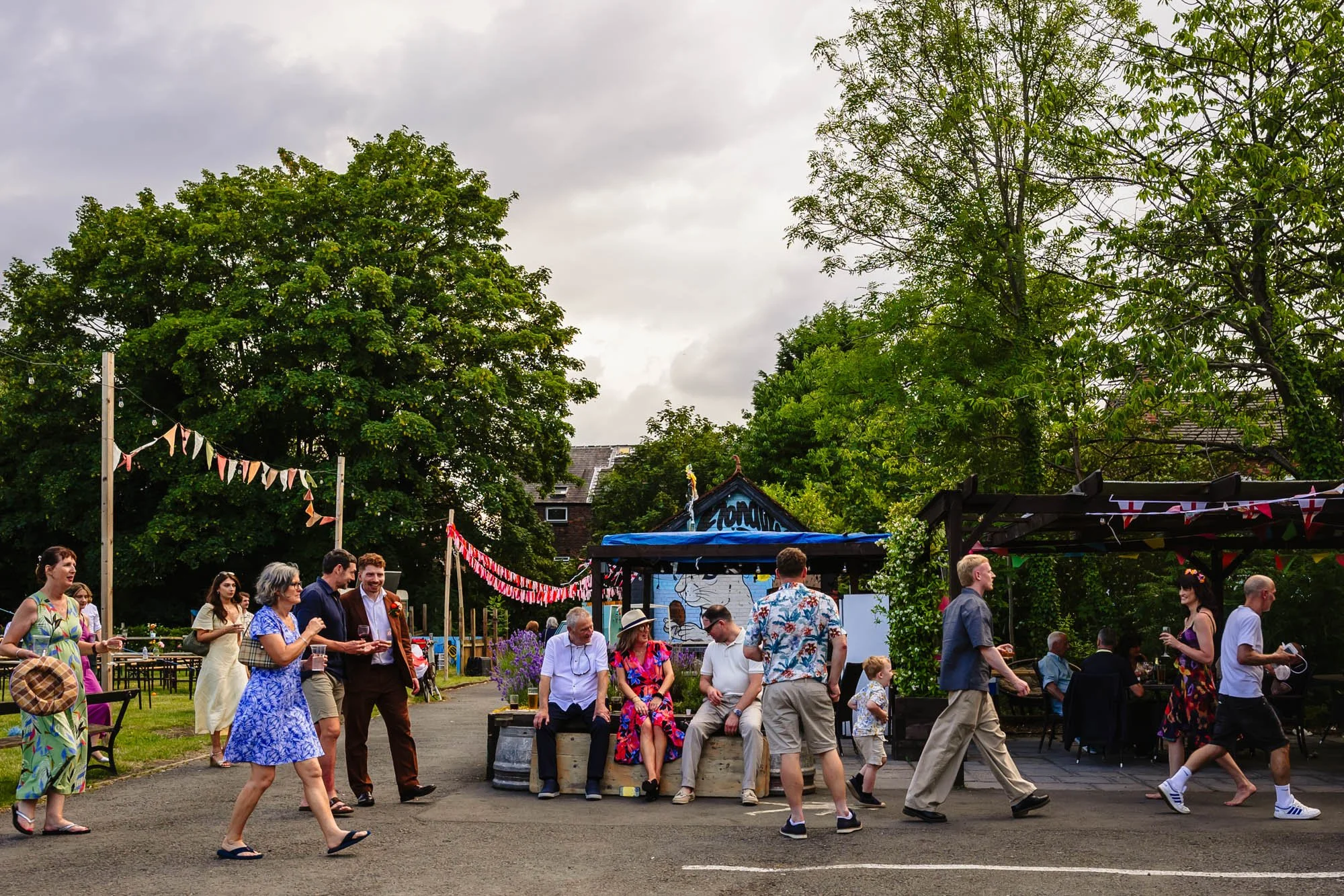  People walk from the outdoor space at the Klondyke inside to the dancefloor at a wedding 