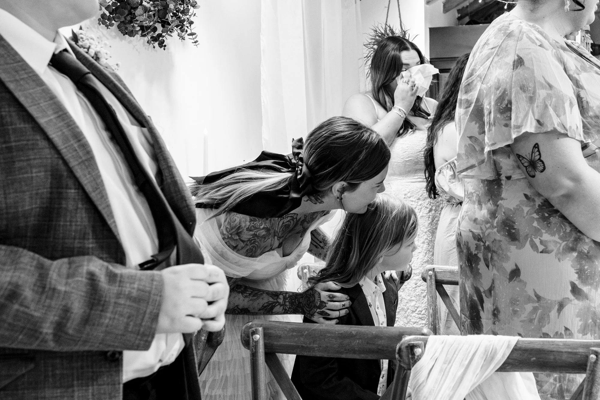 photograph of wedding guests waiting for a couple to walk down the aisle at Lost wedding venue on the wirral