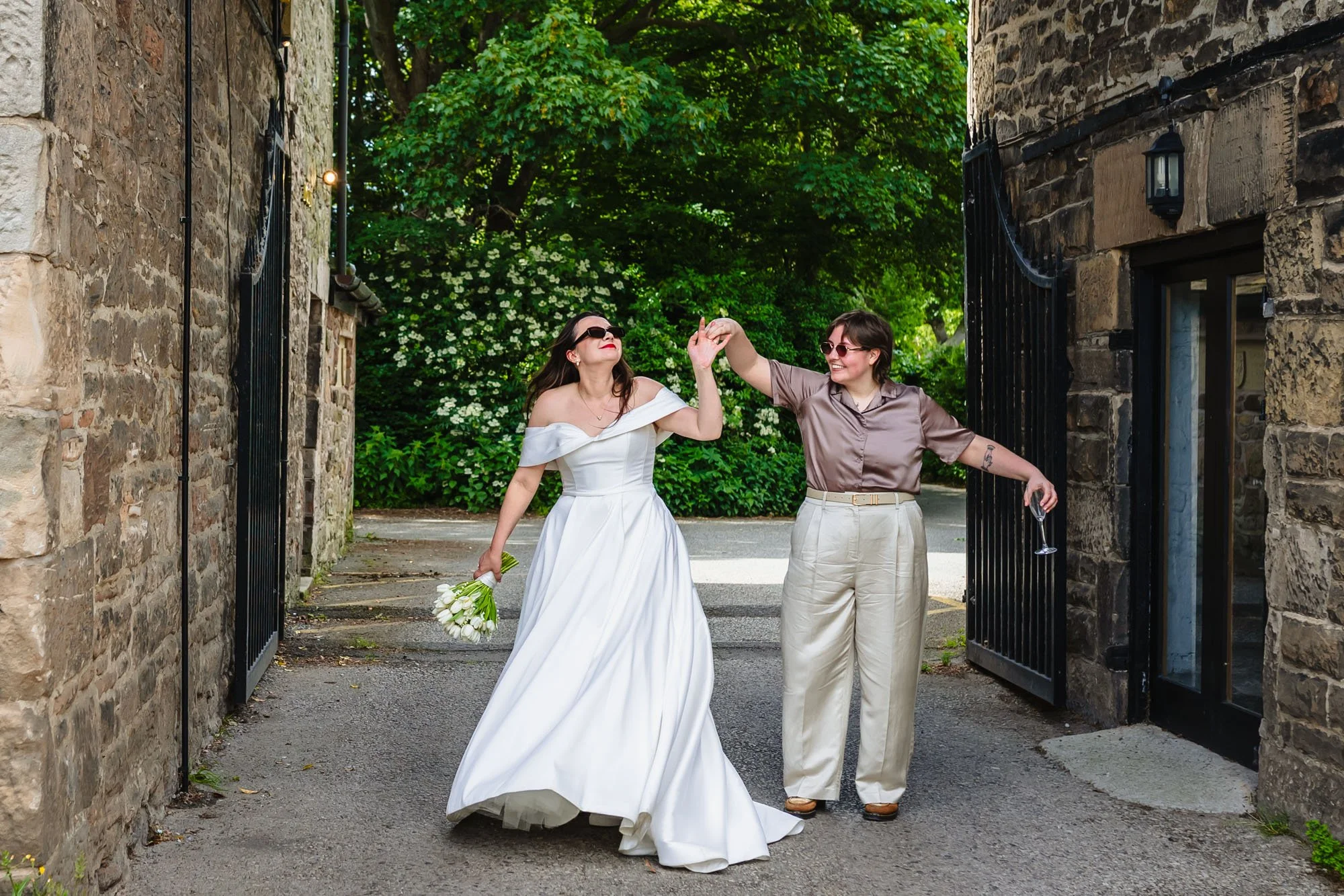 Photograph of a couple dancing in the entryway to Lost wirral wedding venue. They look extremely happy.
