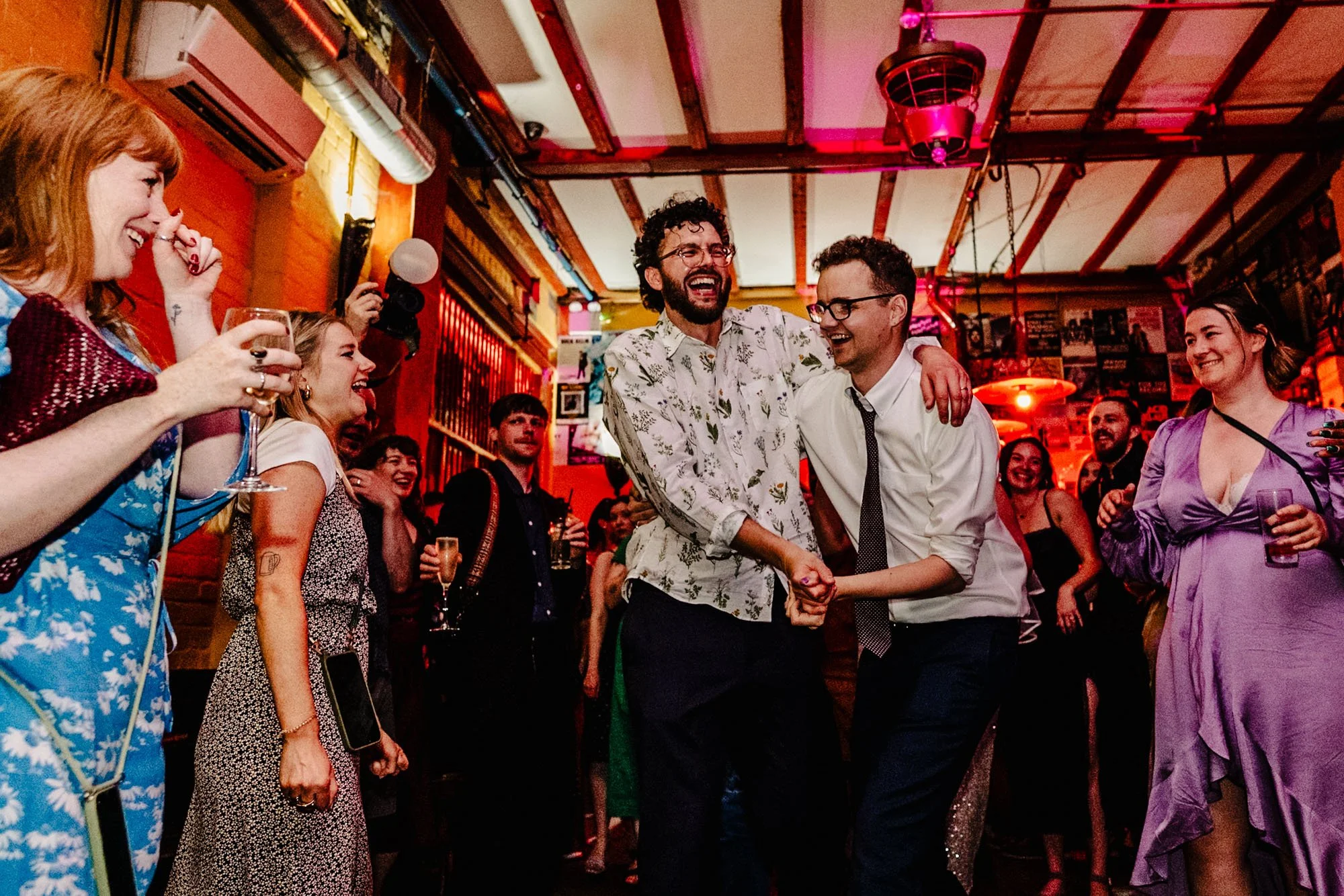 Photograph of two men dancing at a wedding reception at Yellow Arch Studios in Sheffield