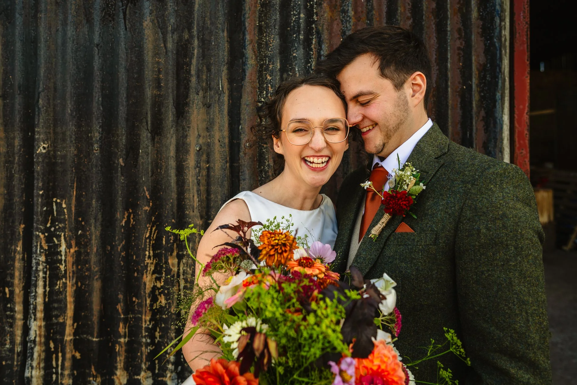 relaxed portrait of a newly married couple outside at Grange Barn wedding venue in Cheshire