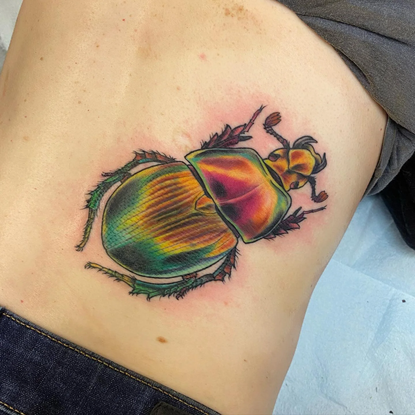 Shiny Scarab cover up for Liz!! Swipe to see the original tattoo!Thank you so much, I had a ton of fun playing with so many bright colors! 

#tattoo #tattoodesign #art #artist #milwaukee #milwaukeeart #milwaukeeartist #milwaukeetattooartist #wisconsi