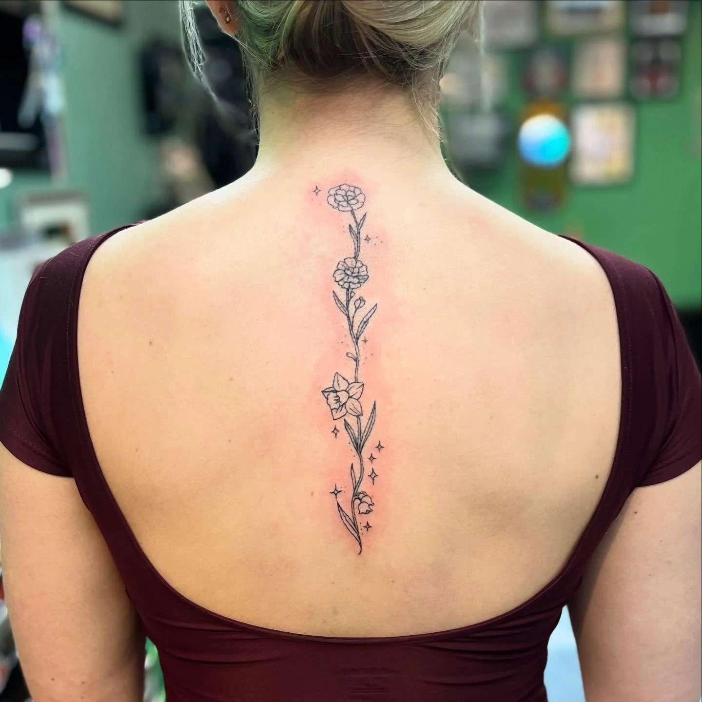 Some cutesy and demure birth flowers #birthflowertattoo #spinetattoo
