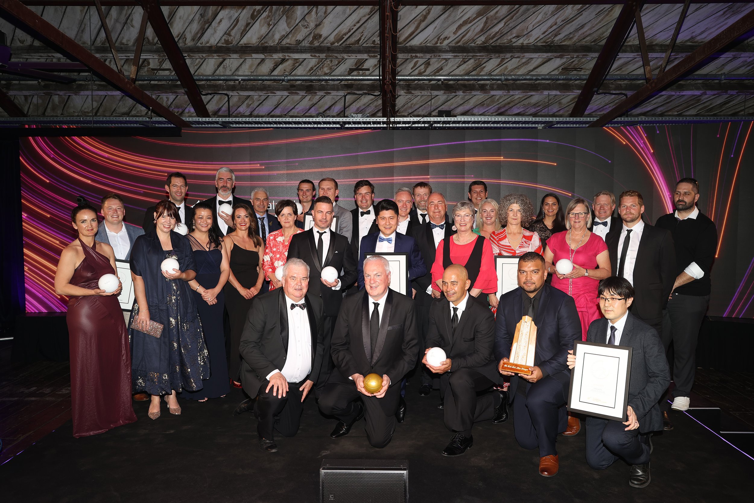  AUCKLAND, NEW ZEALAND - OCTOBER 27: Award winners and presenters pose on stage for a group photo following the New Zealand International Business Awards 2022 at Shed 10 on October 27, 2022 in Auckland, New Zealand. (Photo by Phil Walter/Getty Images