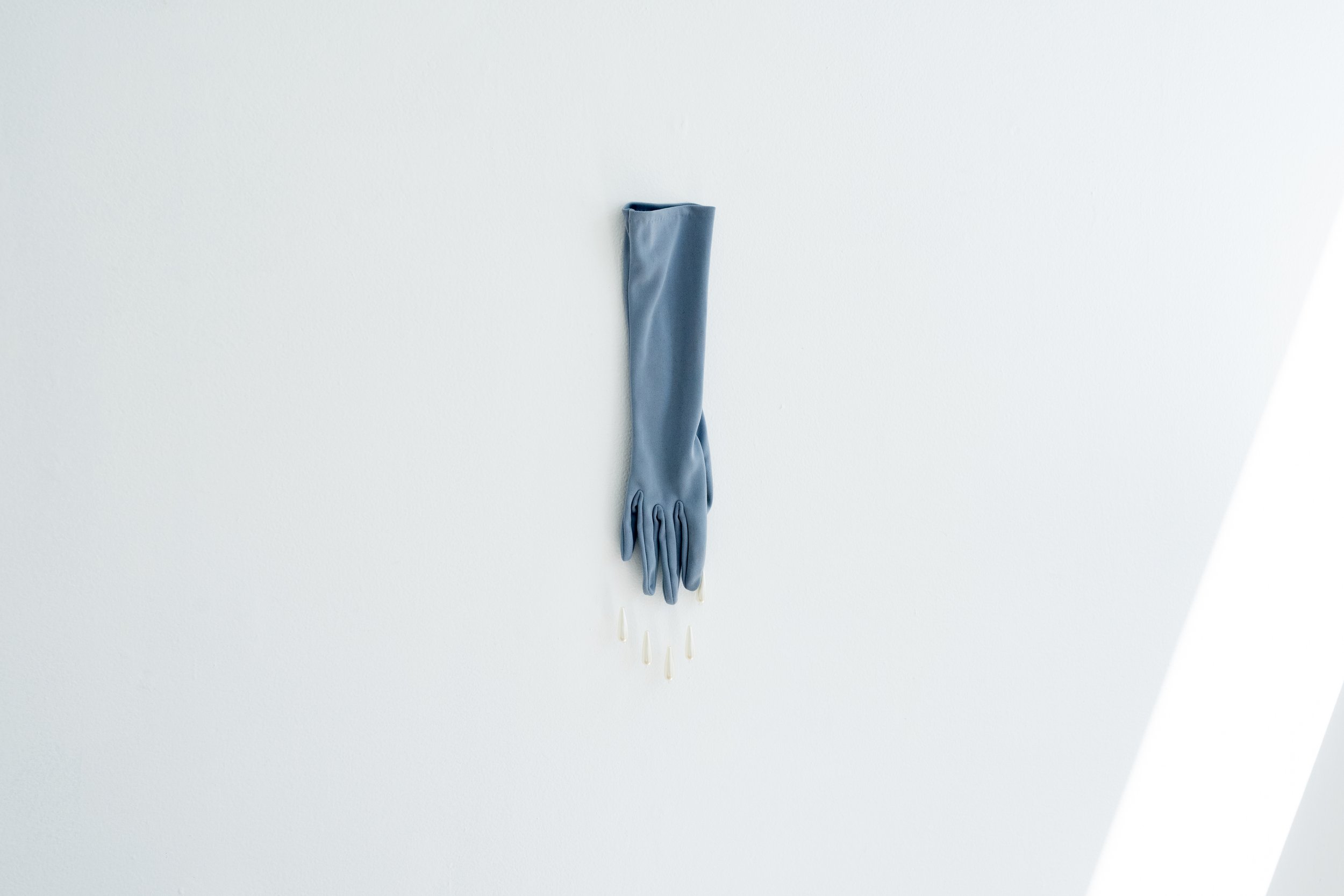  Mambo No. 7  Second-hand gloves, synthetic beads and cotton thread  9 x 40cm  2022  Photograph by Samantha Iliov 
