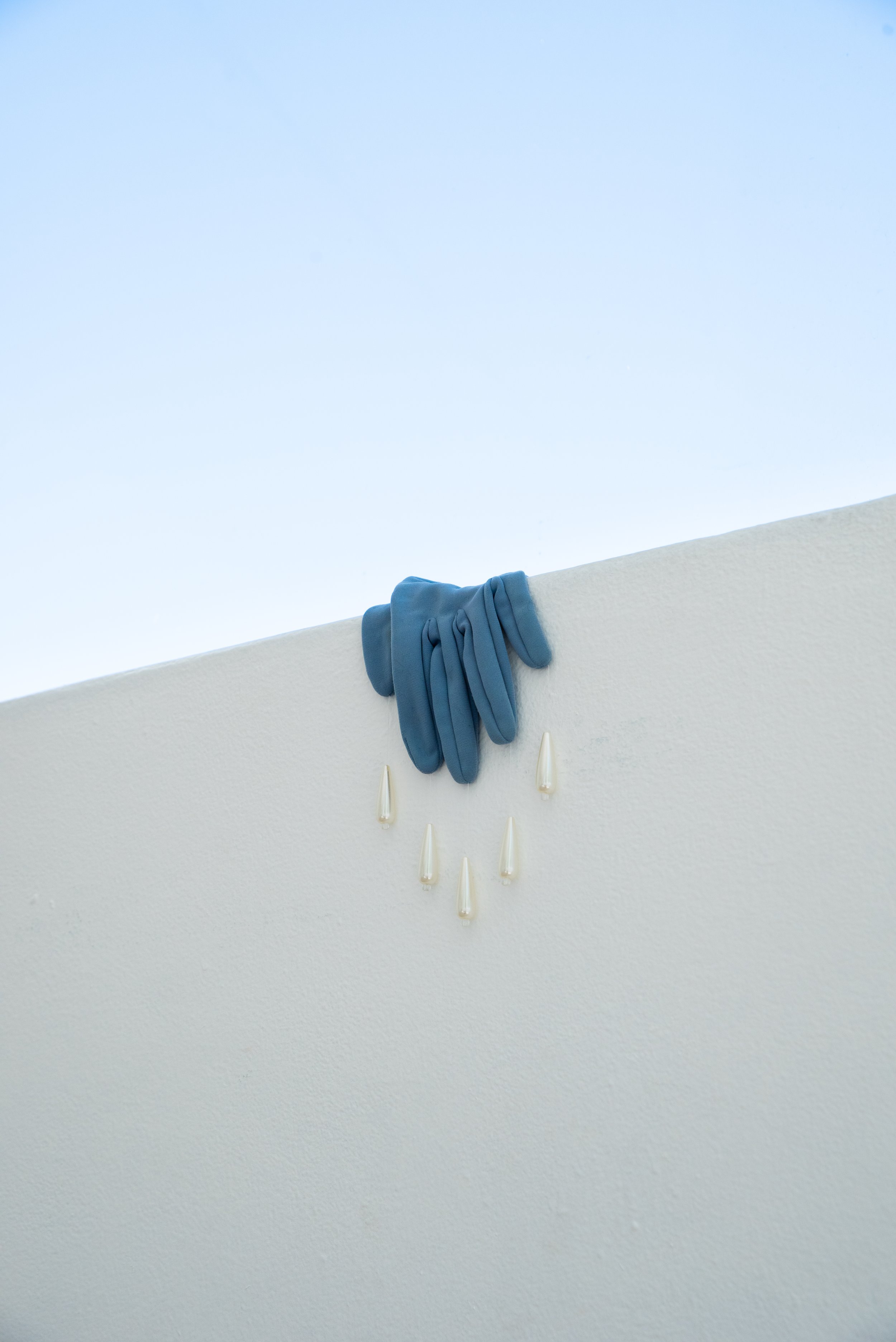  Mambo No. 7  Second-hand gloves, synthetic beads and cotton thread  9 x 40cm  2022  Photograph by Samantha Iliov  