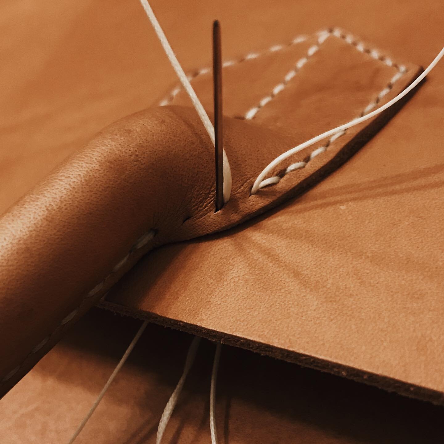 Handstitching the handles on the Classic Tote, available soon on guigo.shop.